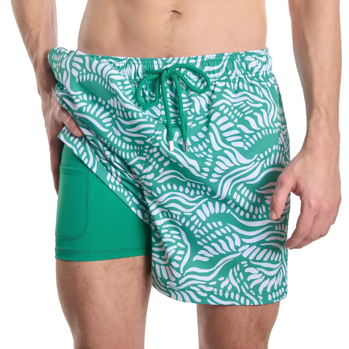 Salt Spray, Palm and Surf men's hybrid swim short, jade green with a white coral reef print, front view showing the green compression liner