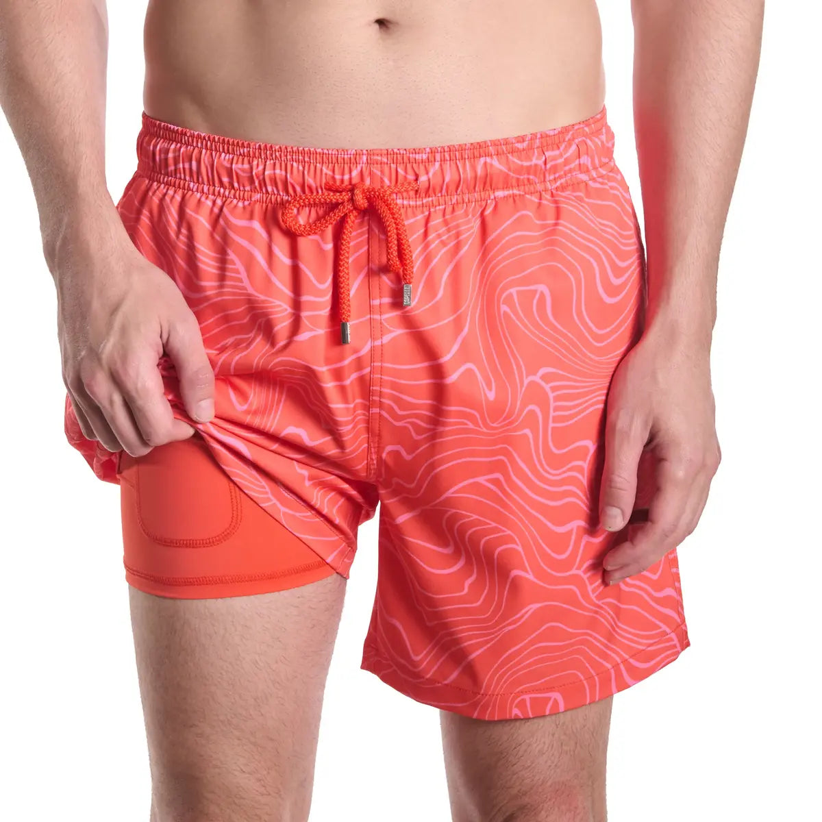 Sand Waves, Heat and Bloom men's hybrid swim short, coral red with a tonal topographic wave line print, front view showing the coral compression liner