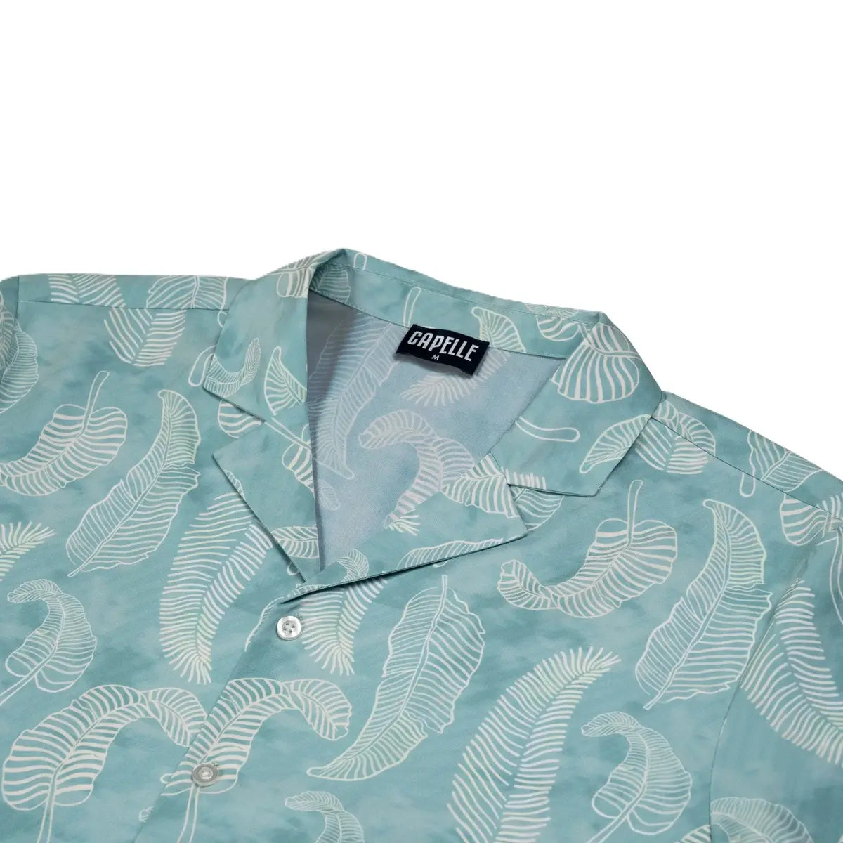 Close-up of the Serenity resort shirt fabric, pale aqua with a tonal paisley print