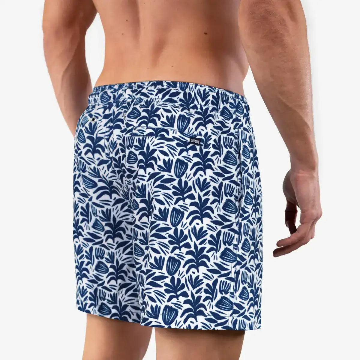 Sonoma Blue men's hybrid swim short in white with a navy floral print, back view