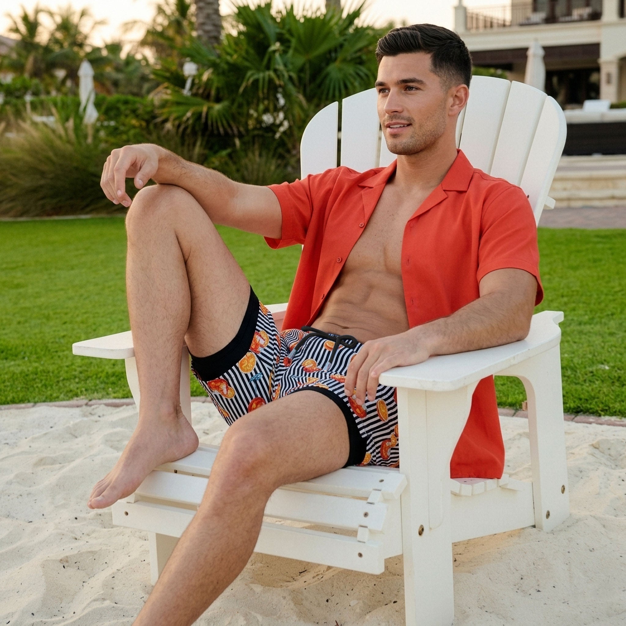 Man in a Coral resort shirt worn open over Sunset Spritz Surf and Storm hybrid swim shorts