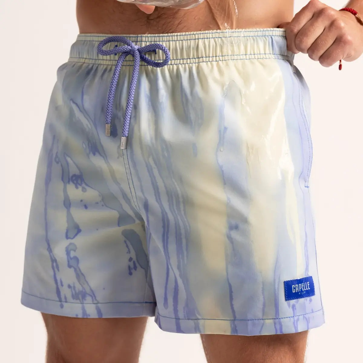 Switch Blue/Mint hybrid swim short shown wet, the blue turning mint green where the water hits