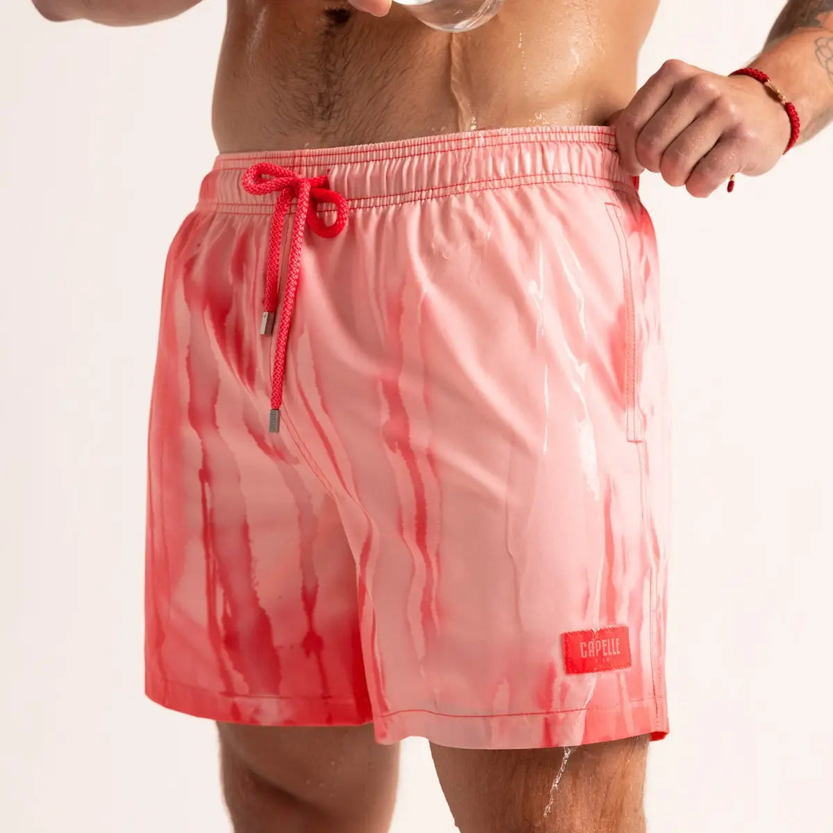 Switch Red/Rosé men's color changing hybrid swim short in red, front view, second angle