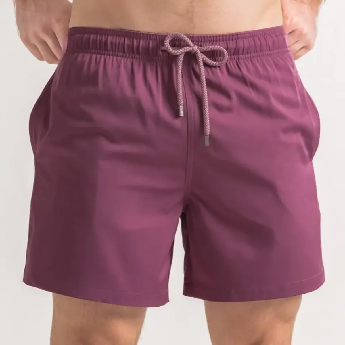 Terracotta men's hybrid swim short in solid dusty mauve, front view, second angle