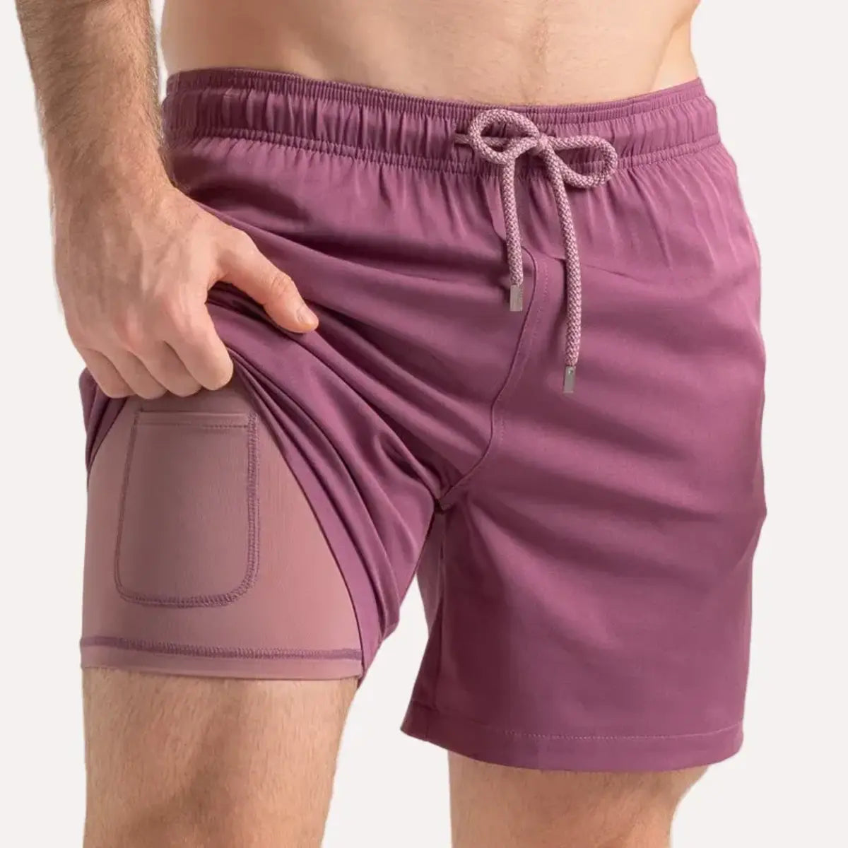 Terracotta men's hybrid swim short in solid dusty mauve with a matching drawstring, front view showing the mauve compression liner
