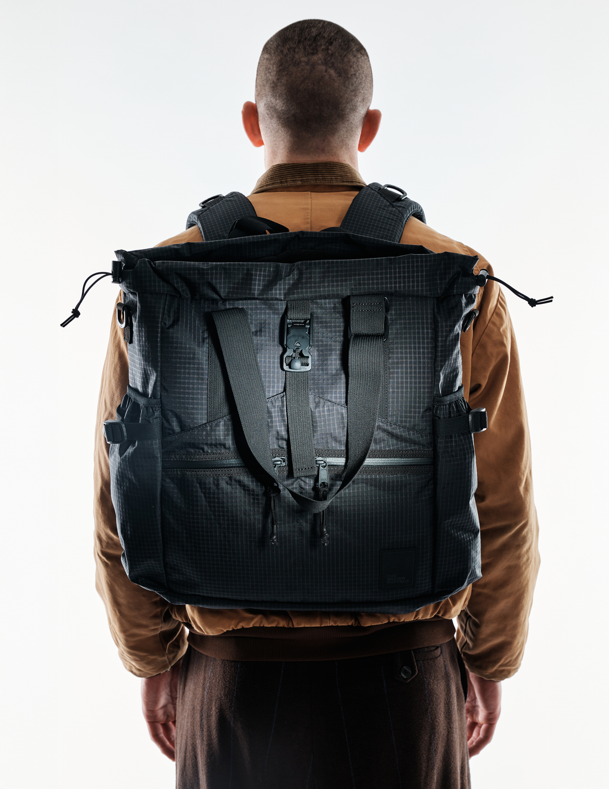 The Brown Buffalo Conceal Tote 20L laptop tote backpack in Black Grid, view 7