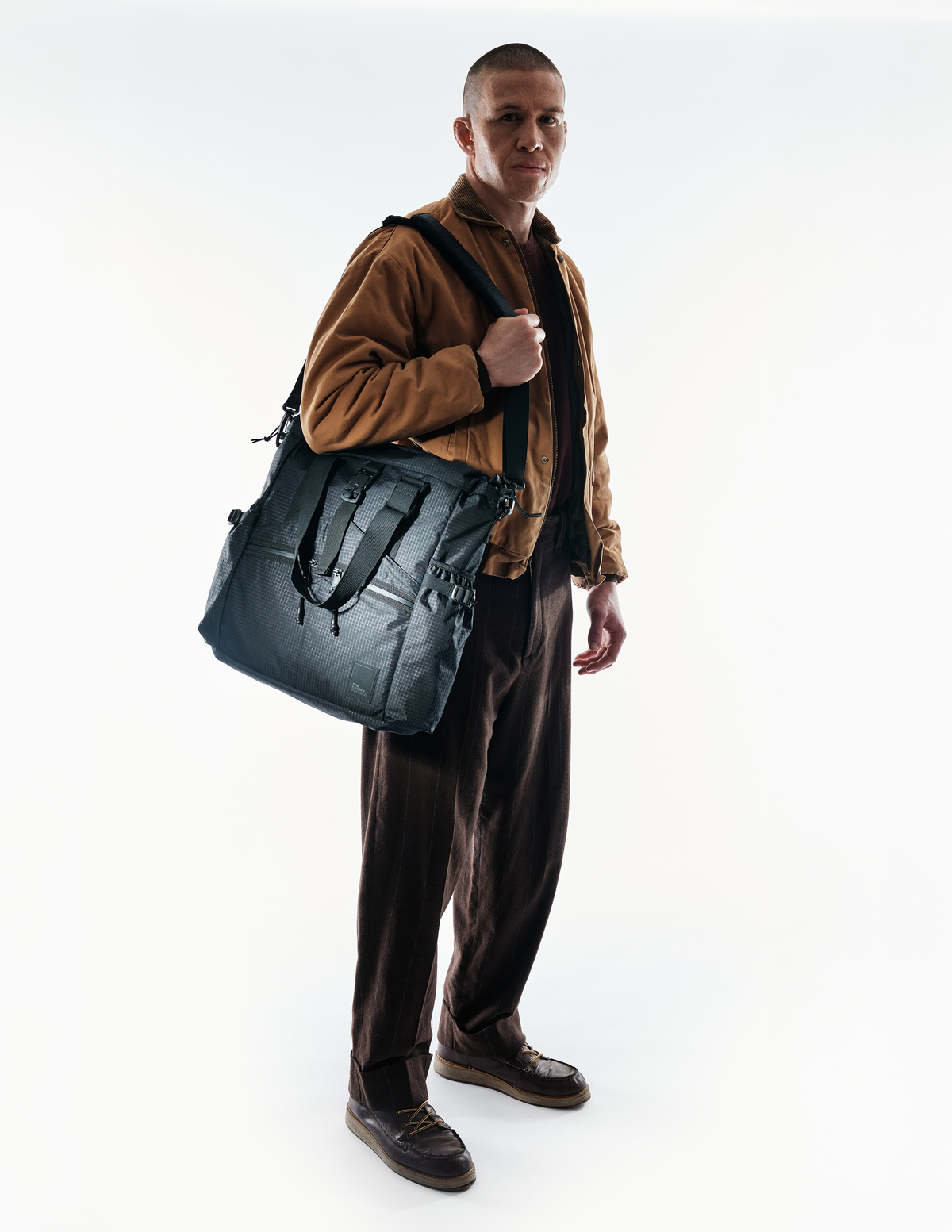 The Brown Buffalo Conceal Tote 20L laptop tote backpack in Black Grid, view 4