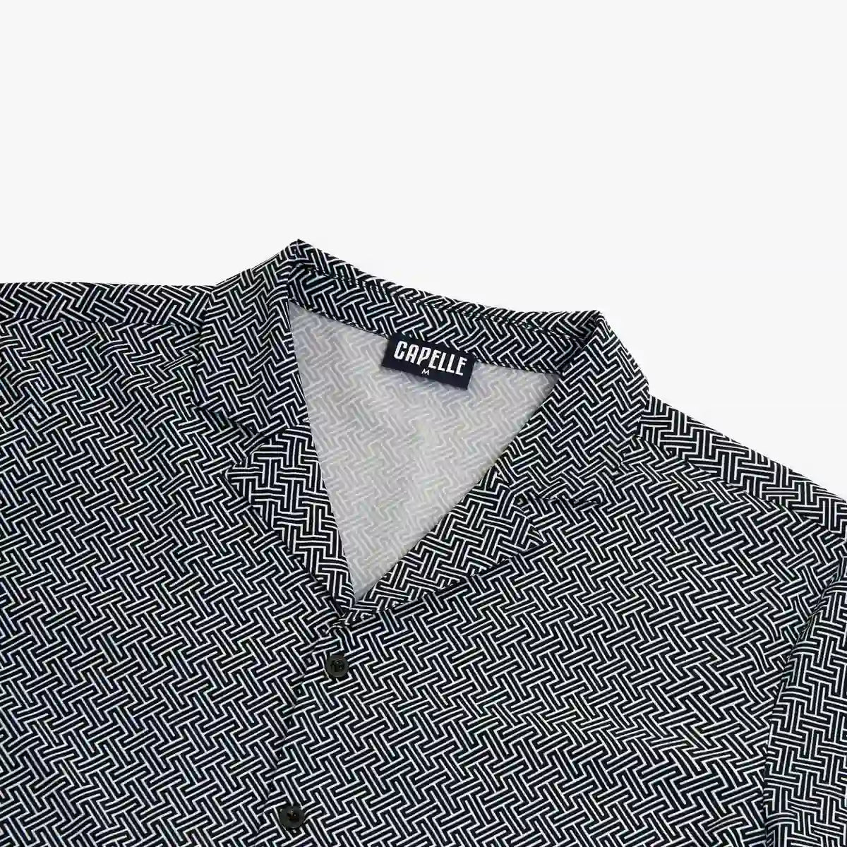 Close-up of The Labyrinth resort shirt fabric, a navy and white micro geometric print