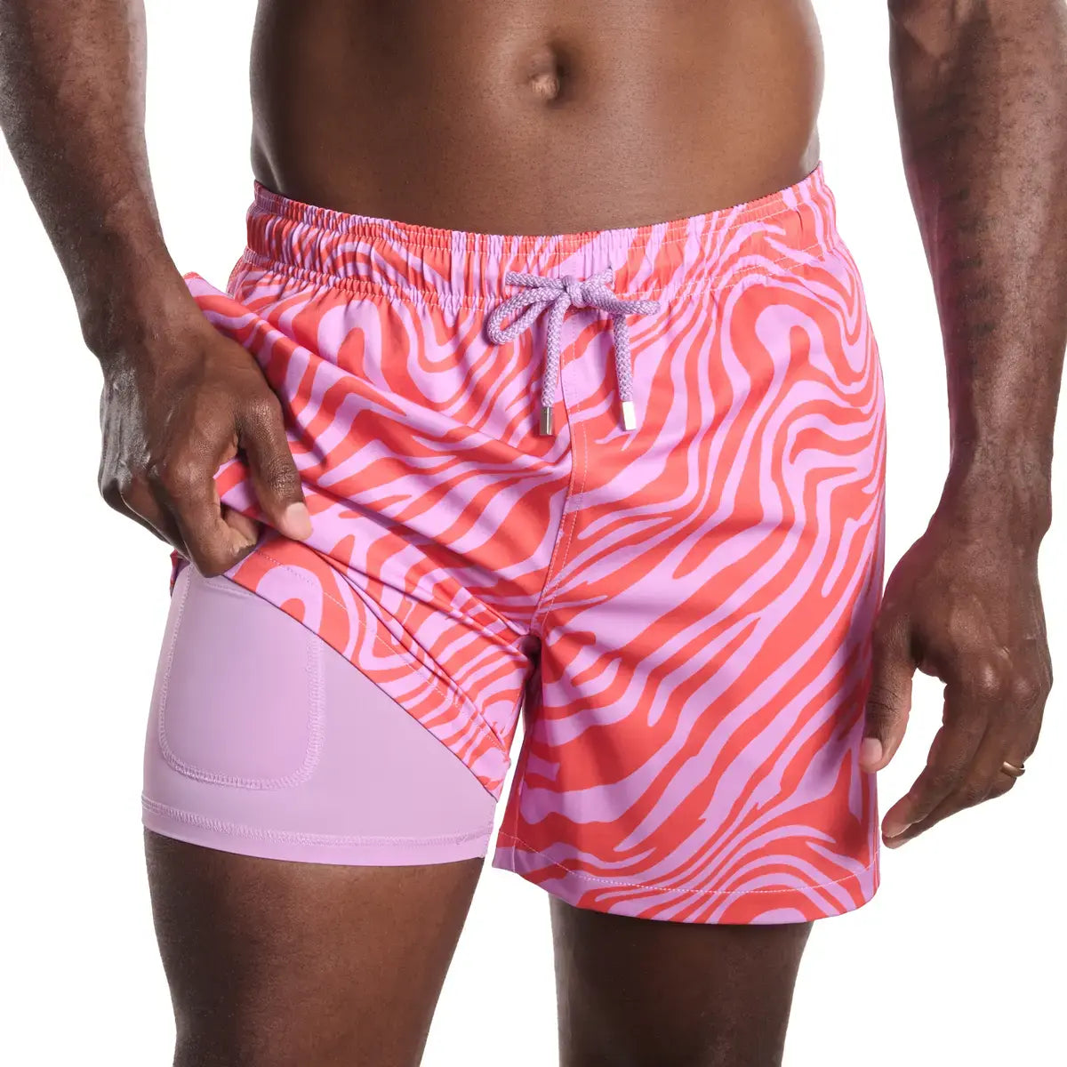 Tropical Swirl, Coral and Orchid men's hybrid swim short, coral and pink swirled zebra print, front view showing the lilac compression liner