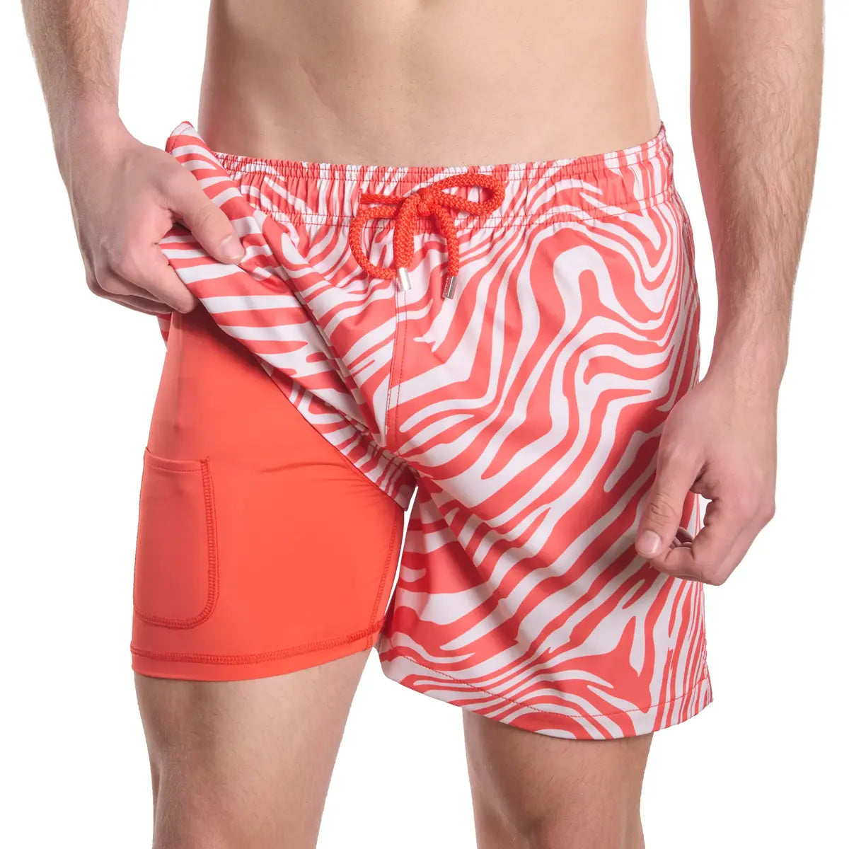 Tropical Swirl, Coral and Sand men's hybrid swim short, coral and white swirled zebra print, front view showing the coral compression liner