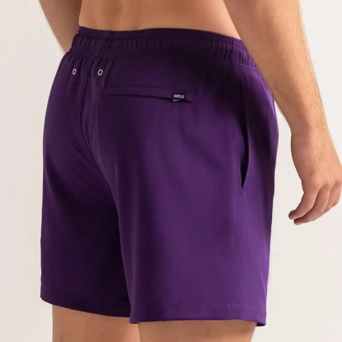 True Purple men's hybrid swim short in solid deep purple, back view