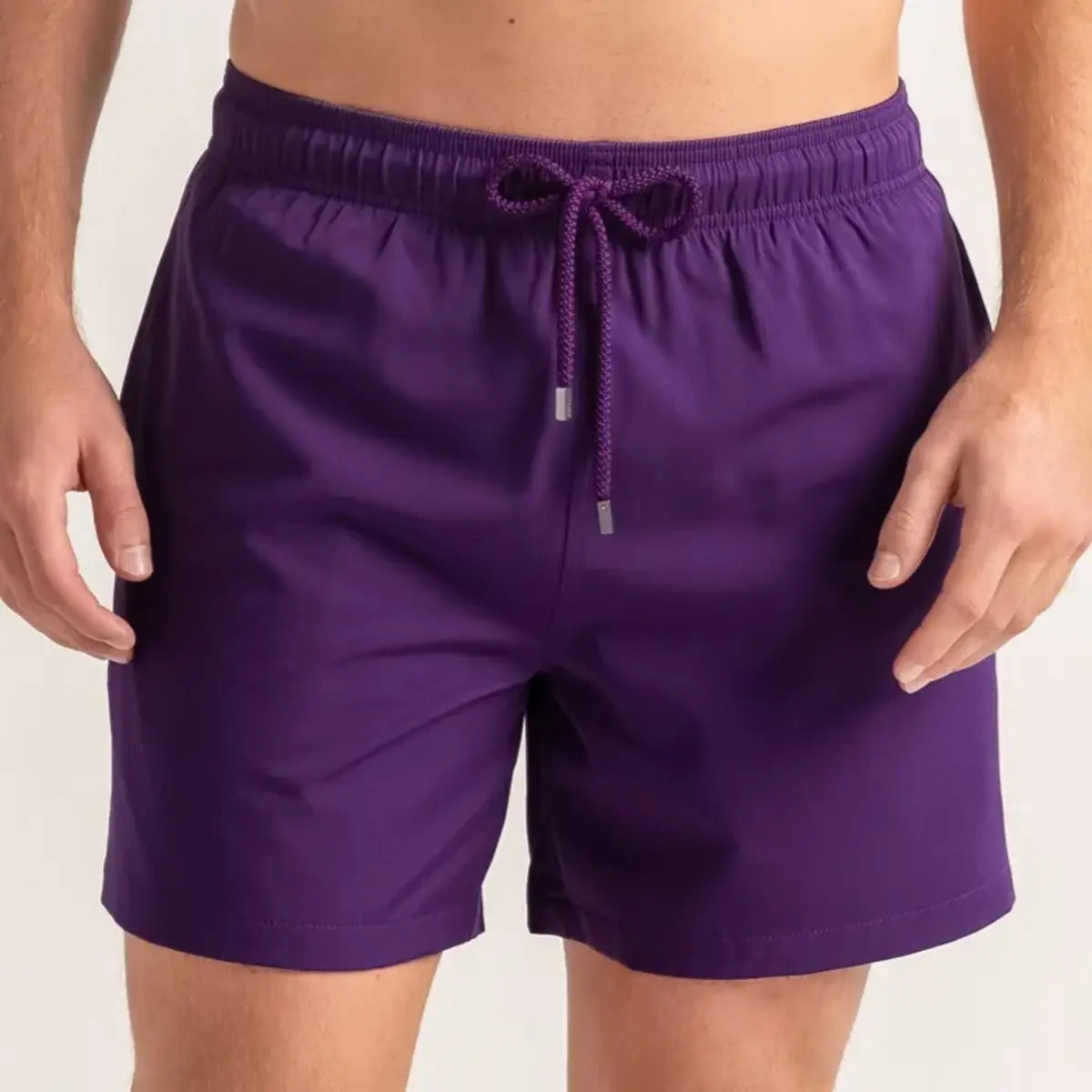 True Purple men's hybrid swim short in solid deep purple, front view, second angle