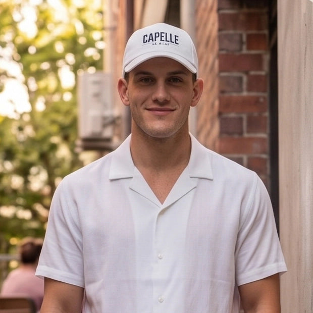 Arctic White Crew Unstructured Cotton Dad Hat worn front on, low profile crown, Capelle Miami