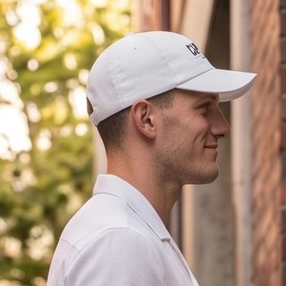 Arctic White Crew Unstructured Cotton Dad Hat worn in profile, curved visor, Capelle Miami